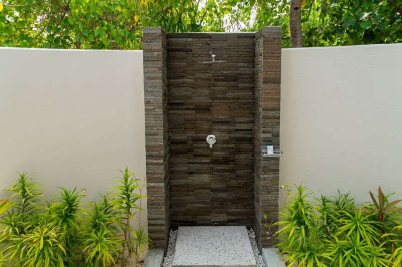 Shower with Natural Stone Wall Accents